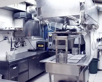 A commercial kitchen with steel appliances