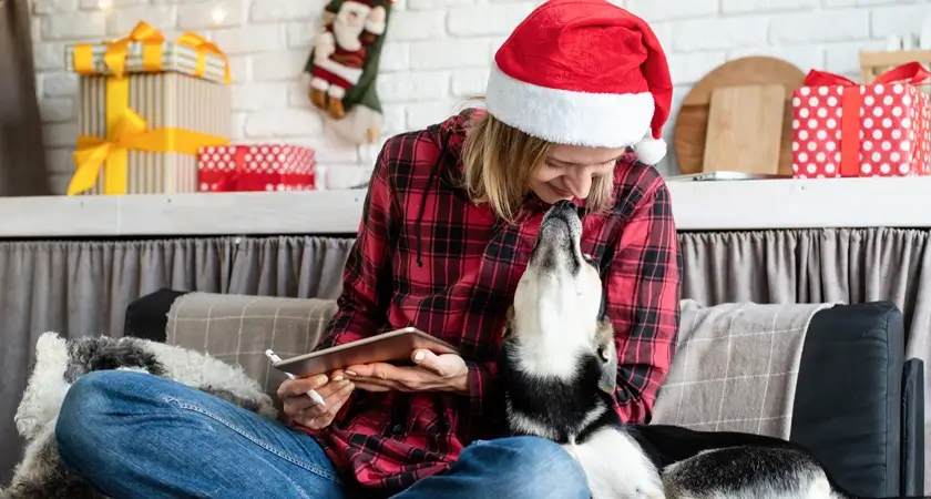 Woman in Santa Hat with Her Dog