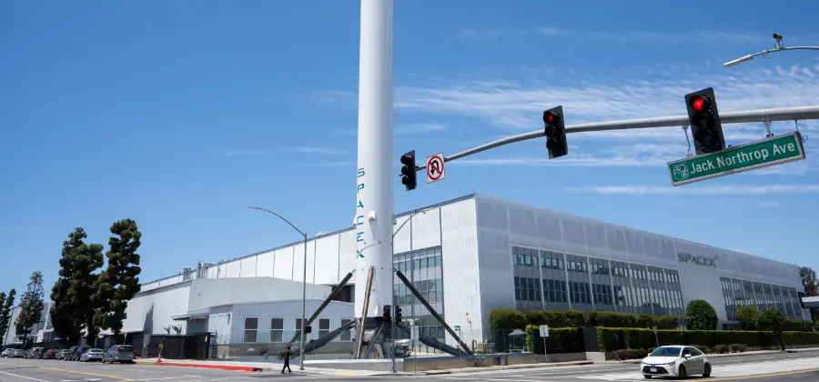 A SpaceX rocket booster is displayed outside the SpaceX headquarters in Hawthorne