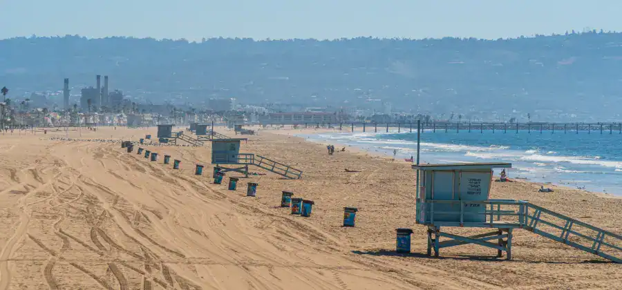 A beach in El Segundo with the power plant in the background